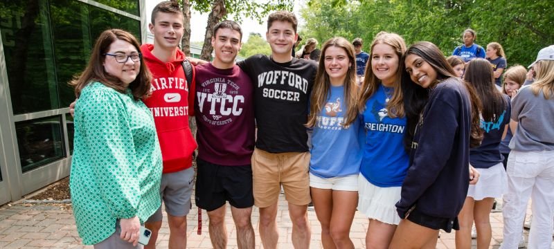 NWC seniors in college shirts