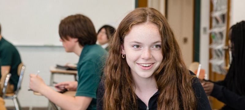 female NWC student in class