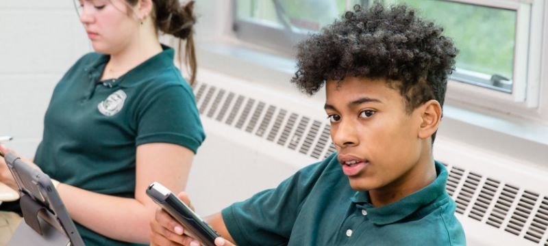 male and female NWC students in class